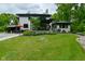 Expansive backyard features a pool, gazebo, patio with seating and lush landscaping at 7070 Dean Rd, Indianapolis, IN 46220