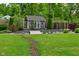 Backyard with shed, landscaping and bridge feature at 7070 Dean Rd, Indianapolis, IN 46220