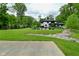 Expansive backyard with a basketball court, pool, and beautifully landscaped areas, creating a versatile outdoor living space at 7070 Dean Rd, Indianapolis, IN 46220