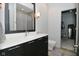 Bathroom featuring a modern vanity, mirror, and view into the walk-in closet at 7070 Dean Rd, Indianapolis, IN 46220