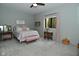 Bedroom featuring neutral walls, carpet, large windows, and tasteful furniture at 7070 Dean Rd, Indianapolis, IN 46220