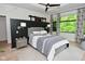 Modern bedroom showcasing stylish decor, accent wall, and plenty of natural light at 7070 Dean Rd, Indianapolis, IN 46220