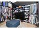 Spacious walk-in closet with ample storage, shelving, and a central ottoman at 7070 Dean Rd, Indianapolis, IN 46220
