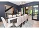 Dining room featuring a long table, chairs, and sliding doors to the living room at 7070 Dean Rd, Indianapolis, IN 46220