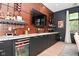 Dining room with a wine bar, wine refrigerator, and cabinets at 7070 Dean Rd, Indianapolis, IN 46220
