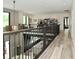 Open hallway with railing overlooking the living area, showcasing the home's modern design at 7070 Dean Rd, Indianapolis, IN 46220
