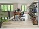 Upstairs home office area with natural light, desk, and shelving for a functional workspace at 7070 Dean Rd, Indianapolis, IN 46220