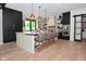 Modern kitchen with a large island, black and white cabinetry, and stainless steel appliances for easy meal prep at 7070 Dean Rd, Indianapolis, IN 46220