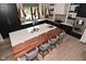 Modern kitchen with sleek countertops, custom stools, and designer pendant lighting for a cozy aesthetic at 7070 Dean Rd, Indianapolis, IN 46220