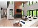 Bright living room featuring a modern fireplace, large windows, and a comfortable white sectional sofa at 7070 Dean Rd, Indianapolis, IN 46220