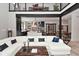 Open-concept living room flowing into the modern kitchen, highlighted by hardwood floors and ample natural light at 7070 Dean Rd, Indianapolis, IN 46220