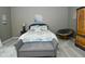 Stylish main bedroom with a cushioned bench at the foot of the bed at 7070 Dean Rd, Indianapolis, IN 46220