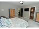 Inviting main bedroom featuring a cozy chair and a picturesque view at 7070 Dean Rd, Indianapolis, IN 46220