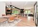Spacious open floorplan showing dining area, kitchen, and living room with fireplace at 7070 Dean Rd, Indianapolis, IN 46220