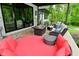 Inviting outdoor patio with stylish seating around a fire pit table and daybed at 7070 Dean Rd, Indianapolis, IN 46220