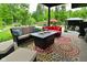 Inviting outdoor patio with stylish seating areas around fire pit tables at 7070 Dean Rd, Indianapolis, IN 46220