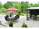 Outdoor dining and bar area with umbrella and seating near the pool at 7070 Dean Rd, Indianapolis, IN 46220