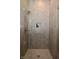 Shower with stone look tiles, rain shower head, glass enclosure, and a built in niche at 7070 Dean Rd, Indianapolis, IN 46220