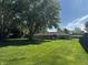 Expansive backyard with healthy lawn and mature trees provides ample space for recreation and relaxation at 7127 Lincoln St, Anderson, IN 46013