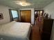 Cozy bedroom featuring hardwood floors, a window, and a closet for ample storage at 7127 Lincoln St, Anderson, IN 46013
