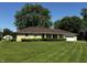 Charming single-story home with a well-manicured lawn, a garage, and lovely curb appeal at 7127 Lincoln St, Anderson, IN 46013