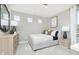 Comfortable bedroom with natural light, calming gray walls, a dresser, and a nightstand at 7145 Firestone Rd, Whitestown, IN 46075
