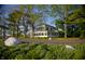 Beautiful two-story home with ample greenery creating a serene and inviting outdoor setting at 7145 Firestone Rd, Whitestown, IN 46075