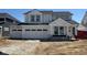 Charming new two-story home featuring a three-car garage and modern architectural details at 7145 Firestone Rd, Whitestown, IN 46075