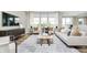 Elegant living room with ample natural light, stylish furniture, and a decorative rug at 7145 Firestone Rd, Whitestown, IN 46075