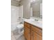 Functional bathroom showcasing a tub-shower, toilet, vanity, and a mirrored medicine cabinet at 7215 Wet Rock Ct, Indianapolis, IN 46236