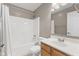 Clean bathroom features a shower-tub combo, wood vanity, white sink, and a large mirror at 7215 Wet Rock Ct, Indianapolis, IN 46236