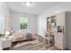 Well-lit bedroom with a desk, bookshelf, comfortable bed, and charming decor, perfect for a  at 7215 Wet Rock Ct, Indianapolis, IN 46236