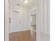Inviting foyer showcasing wood-look floors and a stylish front door with decorative glass detail at 7215 Wet Rock Ct, Indianapolis, IN 46236