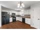 Updated kitchen featuring white cabinets, modern appliances, and stylish backsplash at 7215 Wet Rock Ct, Indianapolis, IN 46236