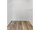 Empty walk-in closet with wood floor, wire racks for optimal storage, and ample room for clothing at 7215 Wet Rock Ct, Indianapolis, IN 46236