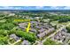 Aerial view of a townhome community near the Monon Trail surrounded by mature trees and landscaping at 73 11Th Nw St, Carmel, IN 46032