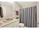 Bathroom featuring a vanity and cabinet with a shower and toilet at 73 11Th Nw St, Carmel, IN 46032