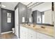 Bathroom with a double sink vanity, decorative mirror and towel racks at 73 11Th Nw St, Carmel, IN 46032
