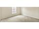 This is a bedroom with neutral carpet and wall paint colors with a window at 73 11Th Nw St, Carmel, IN 46032