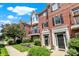 Brick townhouses offer beautiful curb appeal with landscaped front yards, sidewalks, and manicured lawns at 73 11Th Nw St, Carmel, IN 46032