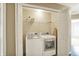 This laundry area has a washer, a dryer, and wire shelving at 73 11Th Nw St, Carmel, IN 46032
