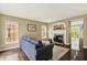 Inviting living room with fireplace, hardwood floors, and natural light at 73 11Th Nw St, Carmel, IN 46032
