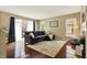 Cozy living room with hardwood floors, a fireplace, and a comfortable couch at 73 11Th Nw St, Carmel, IN 46032