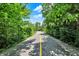 Tree-lined view of the Monon Trail, providing recreational space and access to nature at 73 11Th Nw St, Carmel, IN 46032