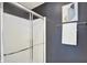 Enclosed shower with glass door and chrome hardware, accented with a neutral towel at 73 11Th Nw St, Carmel, IN 46032