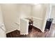 Staircase with dark wood steps, white risers and railings, plus a decor table at 73 11Th Nw St, Carmel, IN 46032