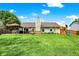 Spacious backyard featuring a large deck with pergola and a playset for children at 7437 Lorene Ct, Indianapolis, IN 46237