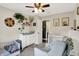 The Bedroom features two white cribs, neutral decor, decorative animal artwork, and a gray rocking chair at 7437 Lorene Ct, Indianapolis, IN 46237