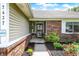 Close up of the front of the house, showing the front door, brickwork, and landscaping at 7437 Lorene Ct, Indianapolis, IN 46237