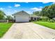 Single-story home with a two-car garage and well-manicured lawn, curb appeal at 7437 Lorene Ct, Indianapolis, IN 46237